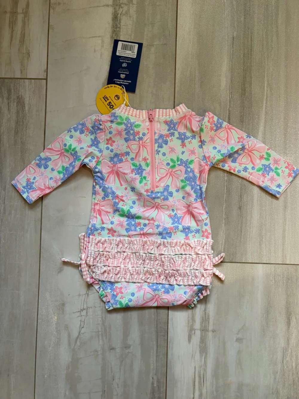 NWT RuffleButts Pastel Bow Blooms Long-Sleeve Rashguard Swimsuit Girls 3-6M